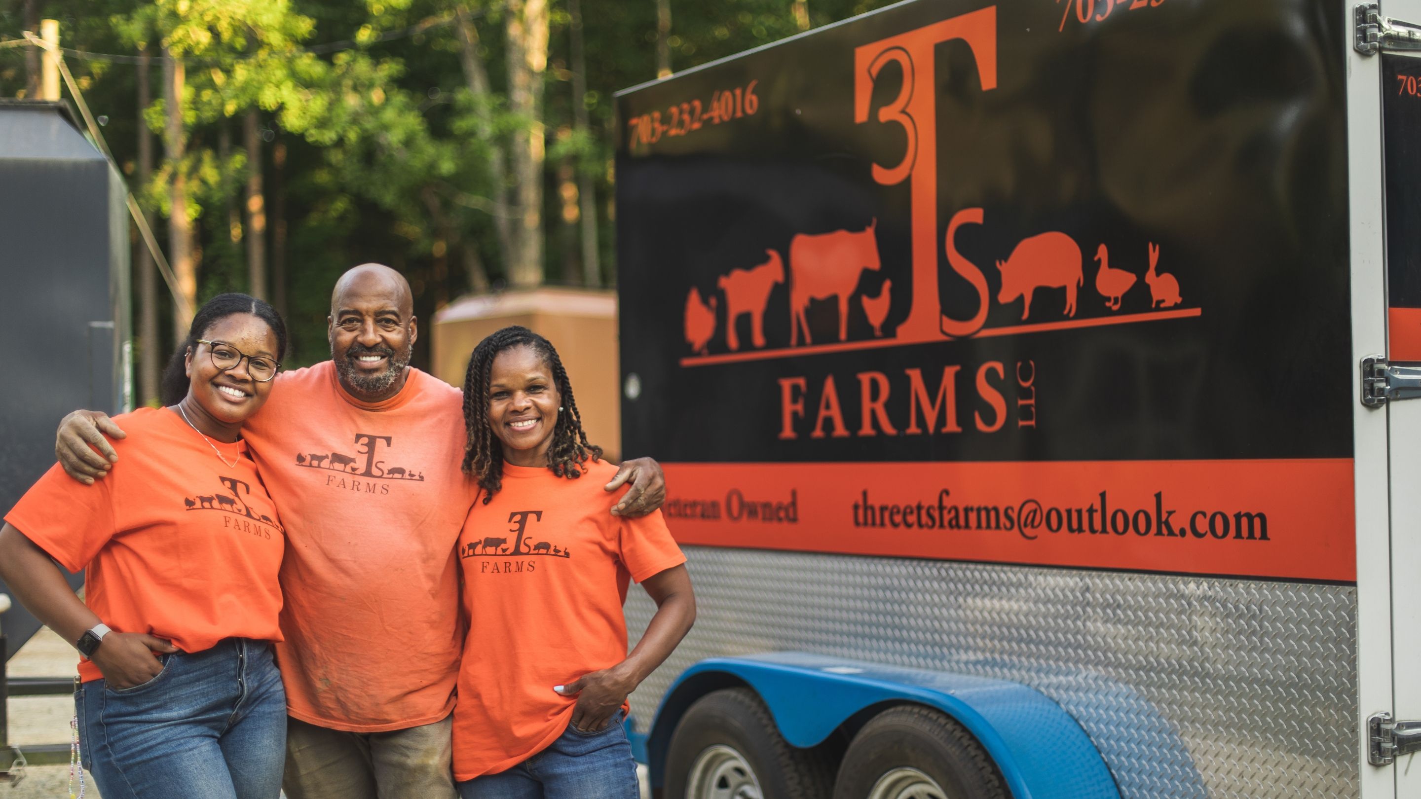 Three generational farmers standing together